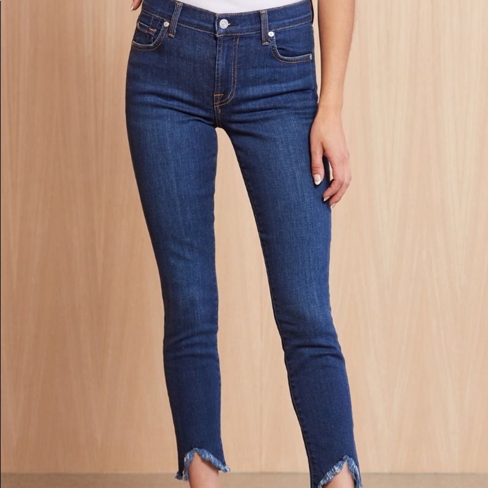 7 for all blue jeans with frayed bottoms